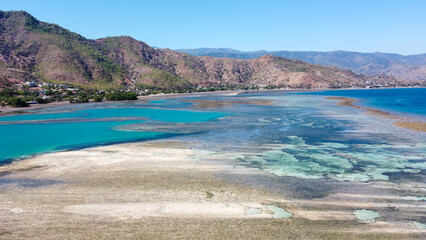 Scenic aerial view of ocean at low tide with patterned sandbars in Coral Triangle region of Dili, Timor-Leste, Southeast Asia