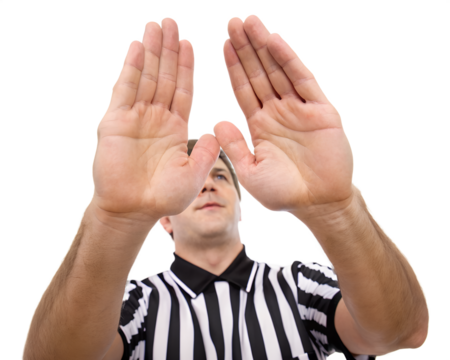 A male referee with short brown hair wearing a black and white striped shirt. He is signaling with both hands raised, against a transparent background.