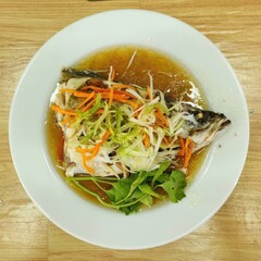 Freshly Cooked Fish Dish with Vegetables and Aromatic Broth