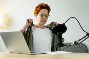 Podcaster Preparing for Recording Podcast in Home Studio