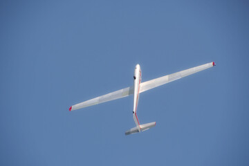close-up of a forward-swept glider making a turn in the sky