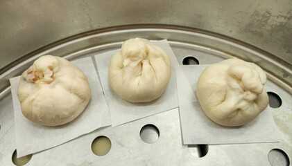 Steamed Dumplings on a Metal Steamer Rack Ready for Serving