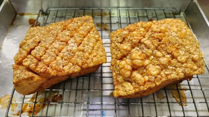 Crispy Pork Belly with Crunchy Crackling on Metal Rack