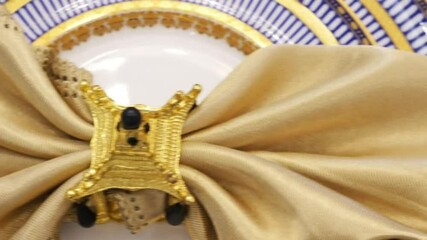 golden napkin ring and plate, creating an elegant table setting. The composition captures the essence of refined dining, inviting viewers to imagine a luxurious meal