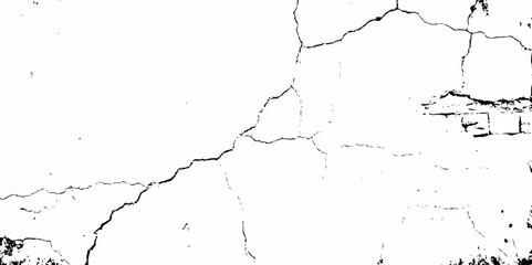 high contrast image showing a cracked white surface, creating a distressed and textured abstract pattern design element