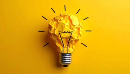 A crumpled yellow paper light bulb illustration on a bright yellow background, symbolizing creativity and innovative ideas