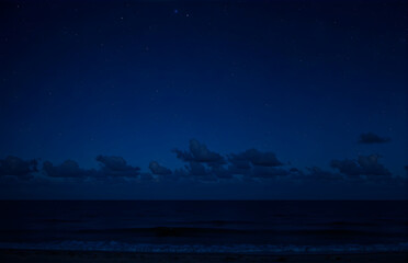 Fototapeta premium Starry Sky Over the Night Ocean