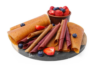 Delicious fruit leather rolls and berries isolated on white