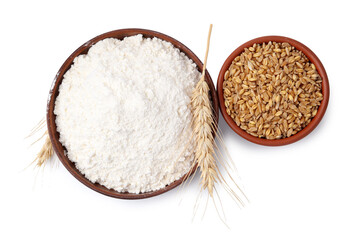 Wheat flour, grains and spikes on white background, top view