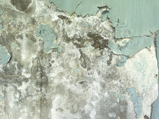 Old plaster with cracks and peeling paint. texture of old wall