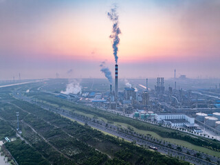 oil refining plant during sunset