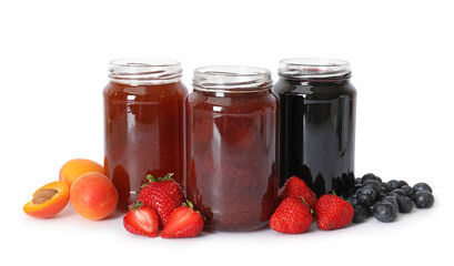 Different jams in jars and ingredients isolated on white