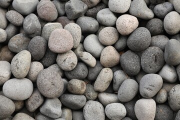 Many different pebbles as background, top view