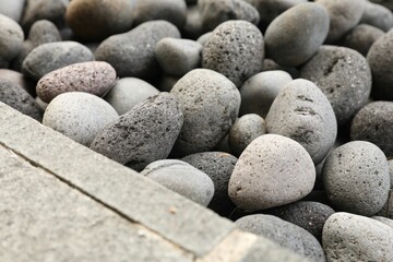 Many different pebbles as background, closeup view