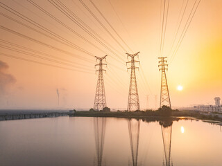 High voltage electricity tower landscape at sunset