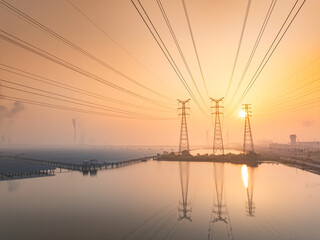 High voltage electricity tower landscape at sunset