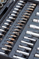 Obraz premium This is a closeup view of a toolbox filled with various bits and sockets