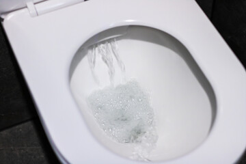 Toilet flush water flow in modern restrooms is vital for sanitation and hygiene