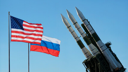 US and Russia Flags Waving Near Sleek Modern Missiles on Launch Platform