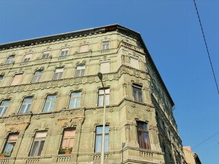 A crumbling building with an ornate facade in Budapest.
