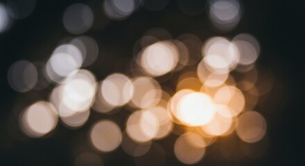 Fototapeta premium Abstract Golden Bokeh Lights on Dark Background