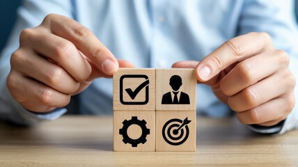 Wooden blocks with symbols for project management.