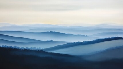 Layered misty hills receding into the distance beneath a soft, light-colored sky