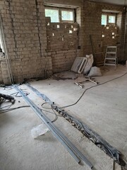 old abandoned house. interior renovation, brick walls, concrete floor and building materials