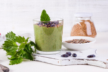 Healthy eating, lifestyle, veganism, alkaline diet, vegetarian concept. Green smoothies from nettle...