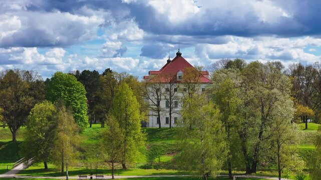 Green Lush Nature Surroundings Of Birzai Castle Along Lake Sirvena In Northern Lithuania. Aerial Shot