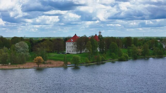 Restored Fortress Of Birzai Castle By The Lake Sirvėna In Northern Lithuania. Aerial Drone Shot