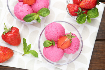 Tasty sorbet with strawberries and mint served on wooden table, flat lay