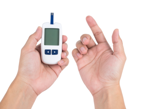 A person holds a blood glucose meter with one hand while the other hand is positioned for a finger prick test.