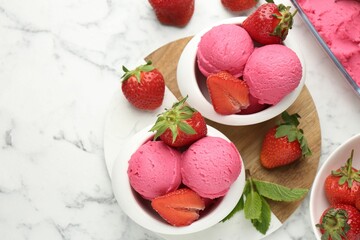 Refreshing sorbet, strawberries and mint on white marble table, flat lay. Space for text