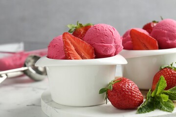 Refreshing sorbet, strawberries and mint on white marble table against grey background, closeup