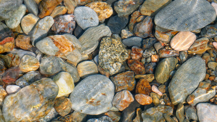 Stones lying on the bottom of the Mediterranean Sea, high detail, summer vacation, travel around Europe