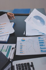 Team of business people working together in the meeting room office,
teamwork background charts and graphs banner, double exposure successful teamwork,business planning concept.