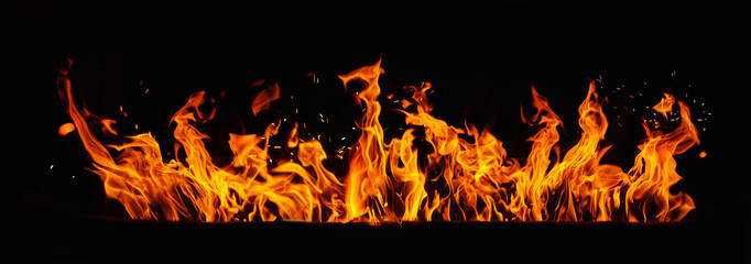  Fire embers particles over black background. Fire sparks isolated on black background. Abstract...