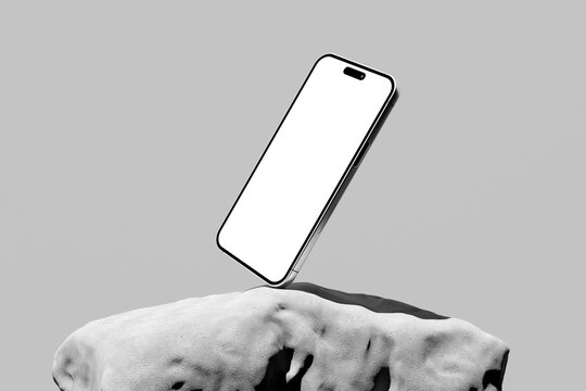 Modern smartphone mockup with a blank screen on textured stones on a gray background.