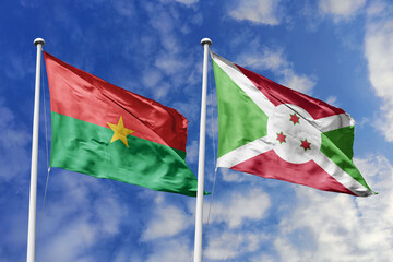 A Burkina Faso and Burundi flag, a metaphor for East African solidarity, wave together against a...