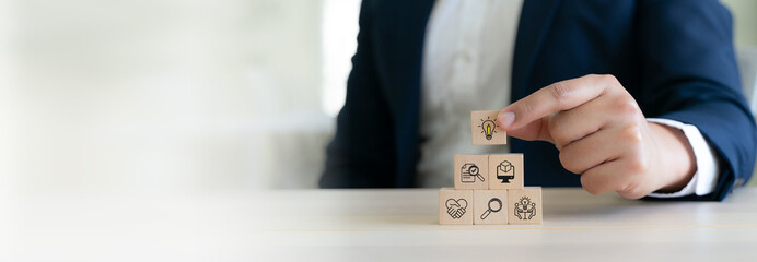 Design Thinking Process concept. Wooden blocks with icons; the key stages of the design thinking...