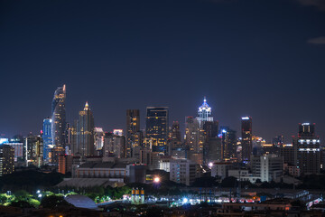 Bangkok city skyline at night with illuminated skyscrapers and modern architecture