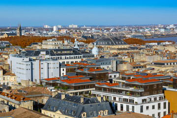 Panoramic elevated view of central and northeastern Bordeaux, showing dense old city rooftops, with...