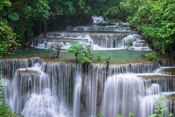 Tropical waterfall with lush greenery at Huay Mae Khamin National Park, Tier 4 Chat Kaeo,...