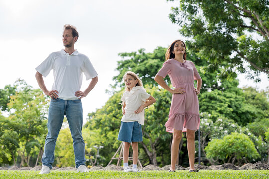 Happy family parent children having picnic outdoor activity. Enjoy happiness moment summer playing together including father mother son and daughter relaxing in the morning sunrise.