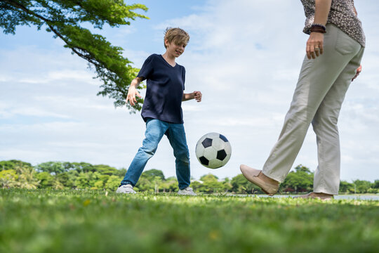 Happy family parent children having picnic outdoor activity. Enjoy happiness moment summer playing together including father mother son and daughter relaxing in the morning sunrise.