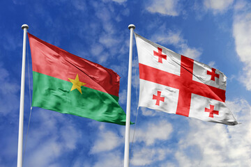 A Burkina Faso and Georgia flag, a metaphor for East-West collaboration, wave together against a...