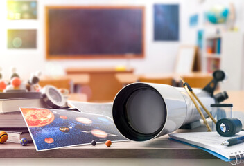Astronomy student table with materials and tools and classroom background