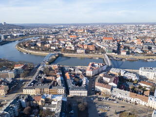 Krakow, Poland: Aerial view of the historic Kazimierz district and the Father Bernatek’s Bridge over the Vistula river in Krakow on a sunny winter day in Poland.