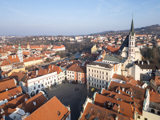 Cesky Krumlov, Czech Republic: Aerial view of Cesky Krumlov old town main square and the St Vitus cathedral in Czech Republic on a sunny winter day.